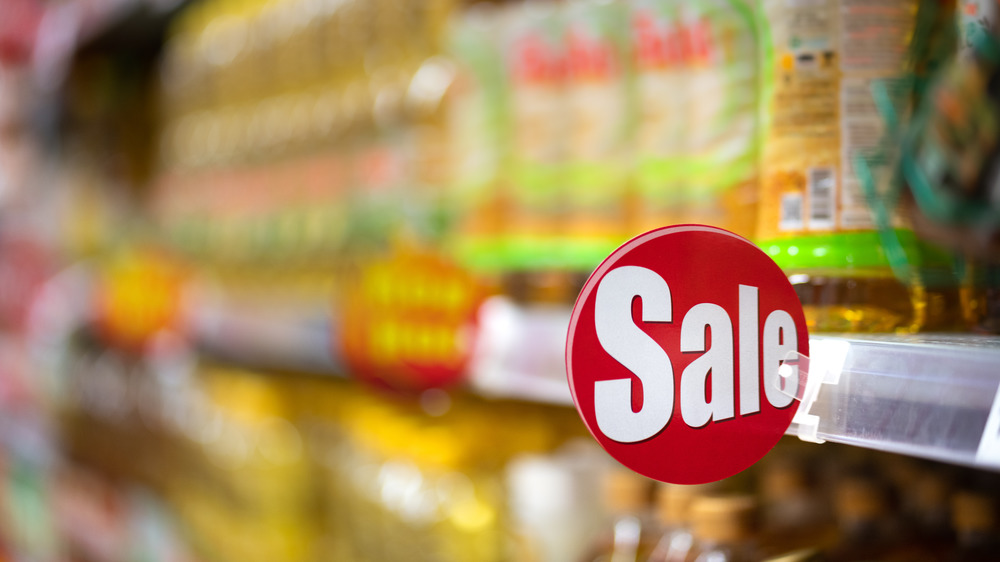 Sale sign on grocery store shelf