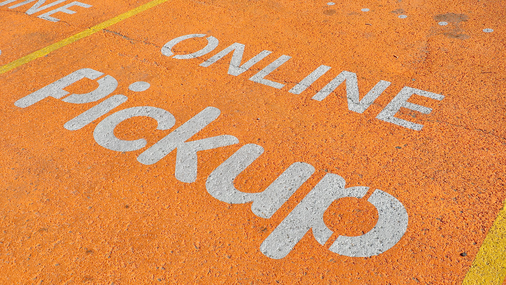 Grocery store pickup sign on pavement