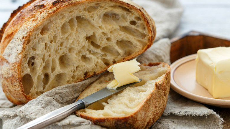 Sourdough loaf with butter and butter knife