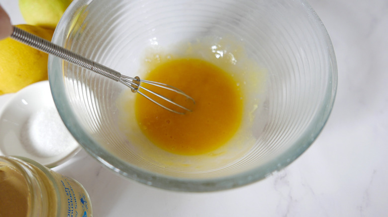 egg yolks and mustard in bowl 