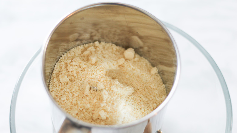 Almond flour and sugar in a sifter