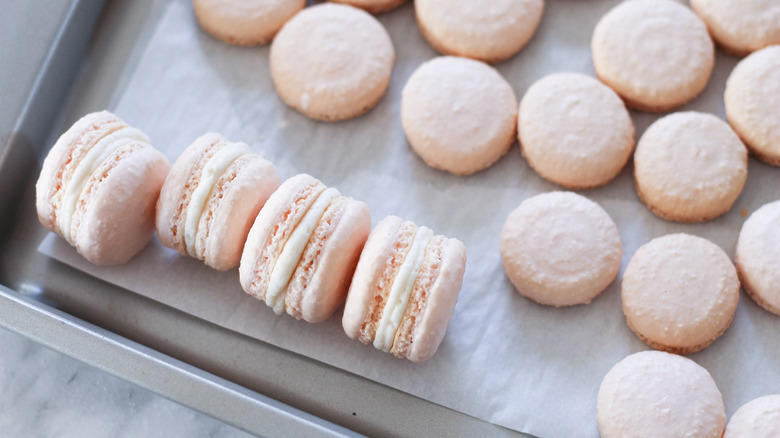 salted caramel macarons on a baking sheet