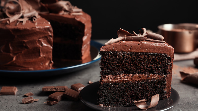 sliced and whole chocolate cake