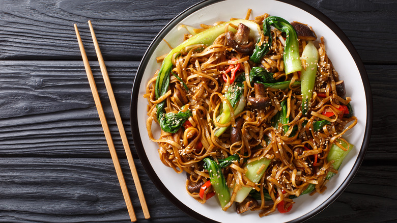 Udon noodles on plate with chopsticks 