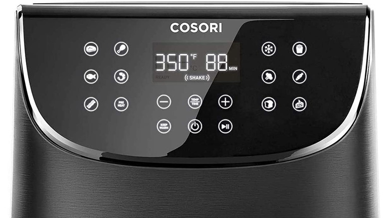 The Cosori logo above the air fryer interface