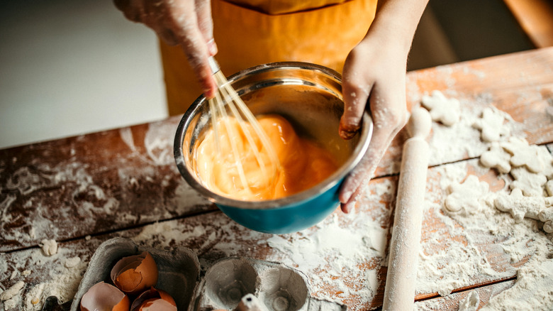 whisking eggs in bowl