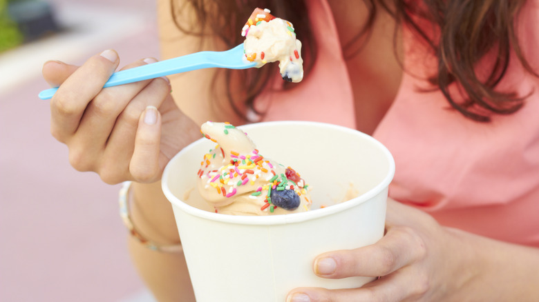 person eating frozen yogurt