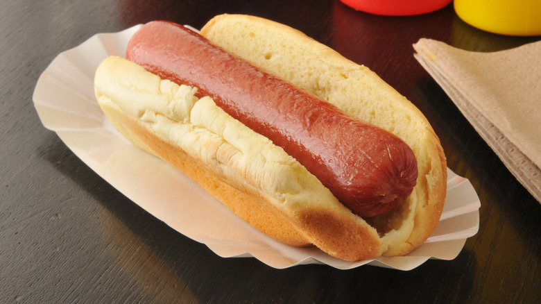 Plain hot dog on table