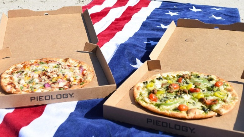 two pizzas on american flag beach towel