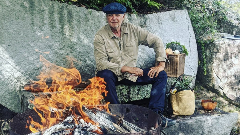 Francis Mallmann next to a fire