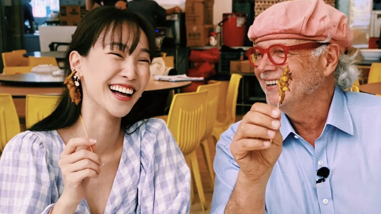Francis Mallmann laughing while eating