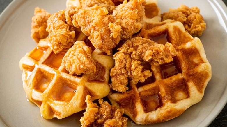 Closeup of chicken and waffles with syrup