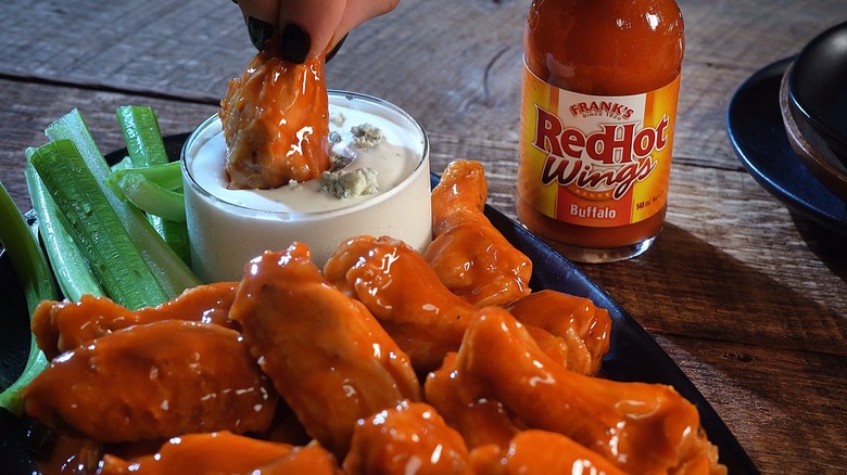 Frank's RedHot buffalo wings dipped into dressing