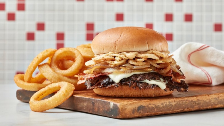 steakburger on wooden plank