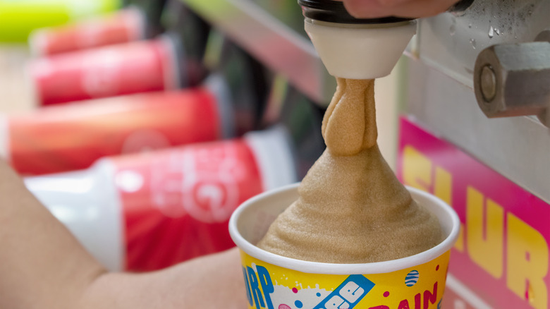 Coca-Cola slurpee dispensing into a cup