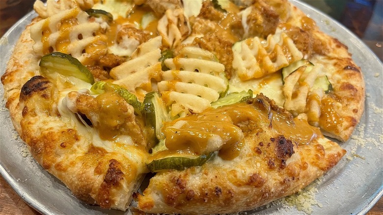 french fries and pickles on pizza