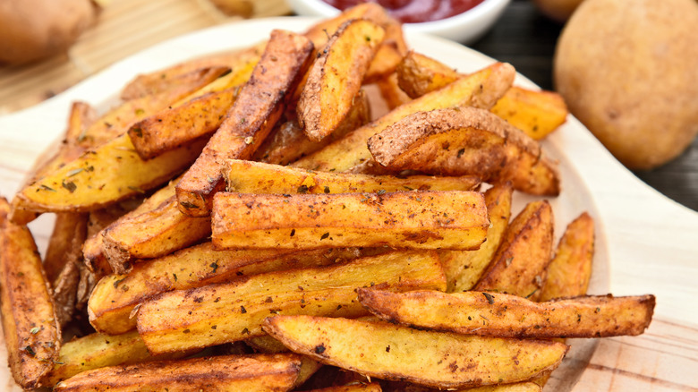 Fries on wooden board