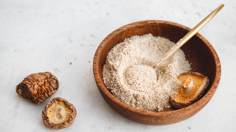 Mushroom powder in wooden bowl