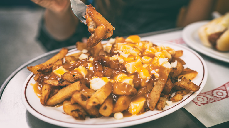 Eating poutine with fork