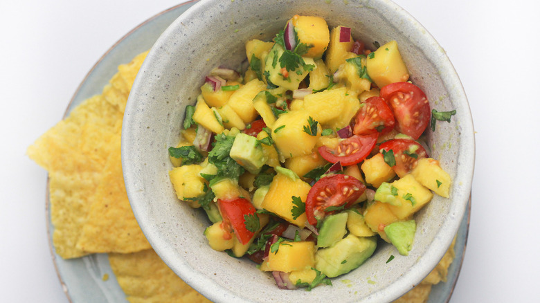 Mango salsa next to tortilla chips