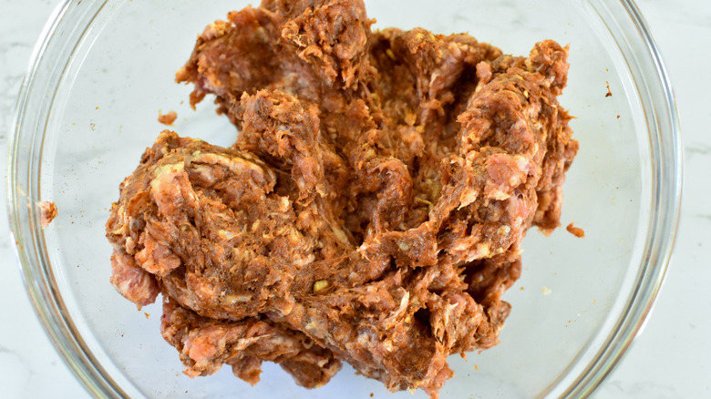 uncooked chorizo in glass bowl