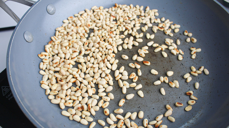 Pine nuts in frying pan