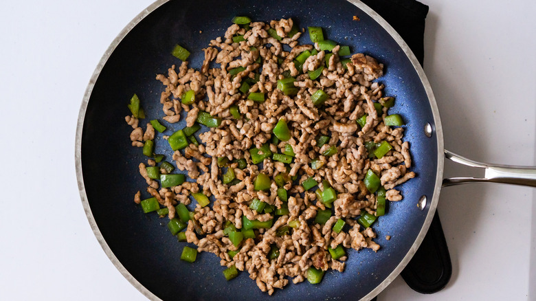 Sausage and green pepper in a skillet