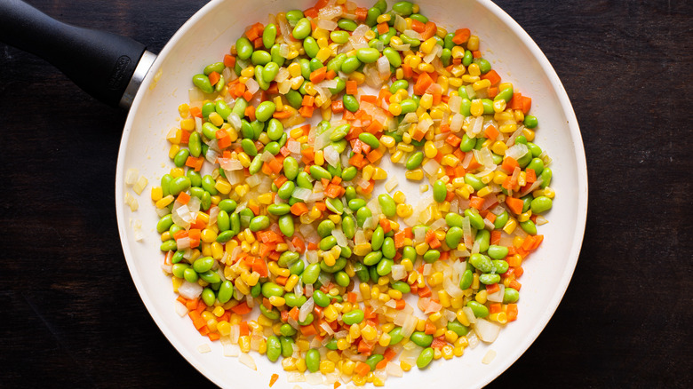 cooked vegetables in a skillet