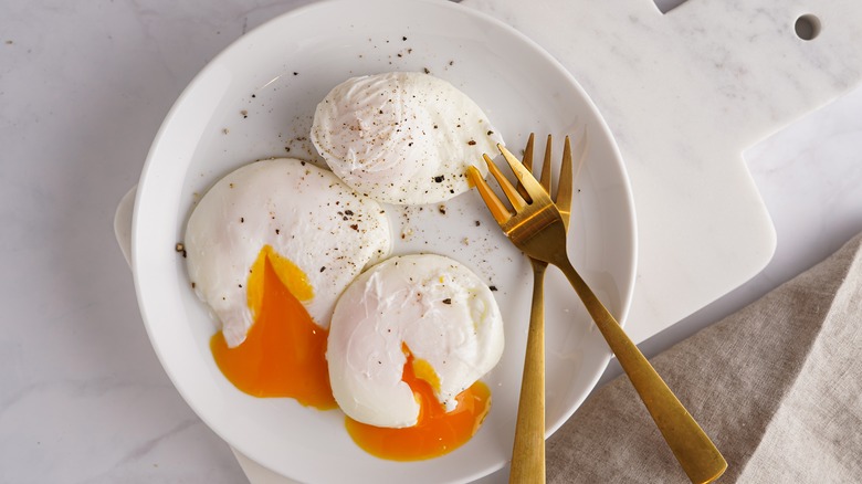 sliced poached egg with forks