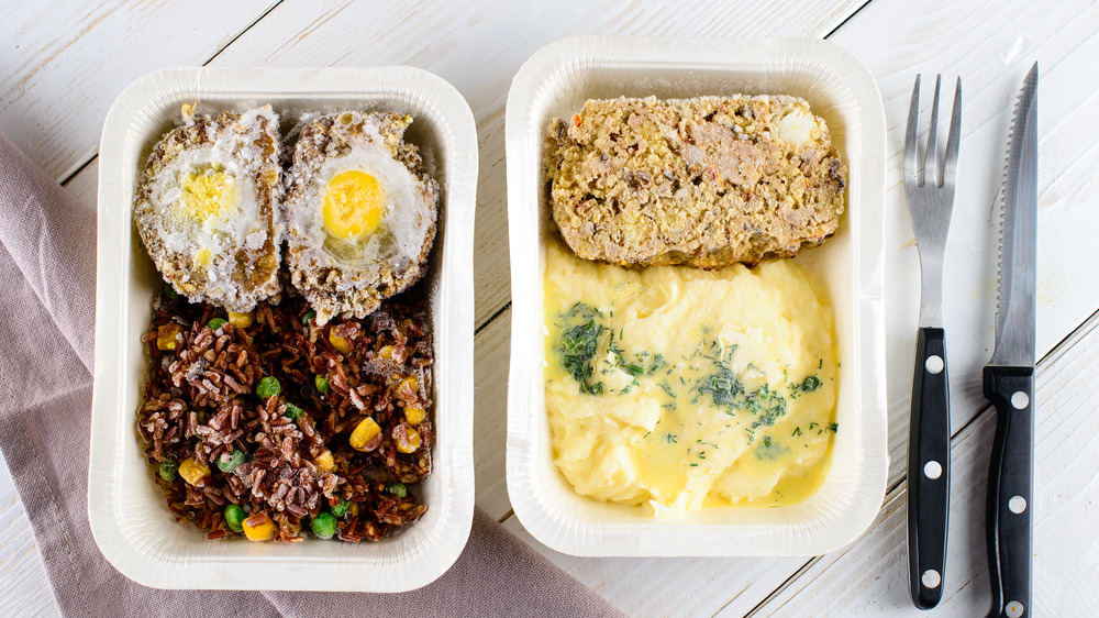 Frozen TV dinners in white trays