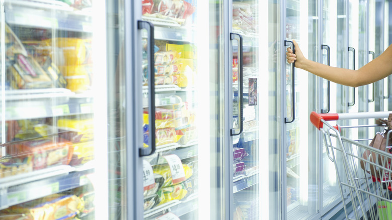 shopping in frozen section grocery