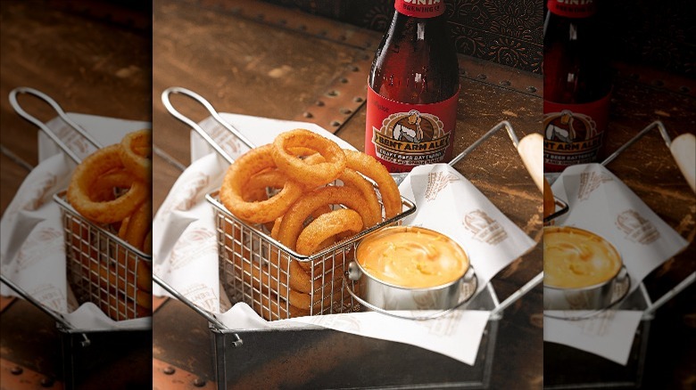 Basket of Simplot Bent Arm Ale Onion Rings and bottle of ale