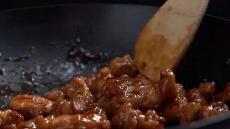 Mandarin Orange Chicken being fried in a pan