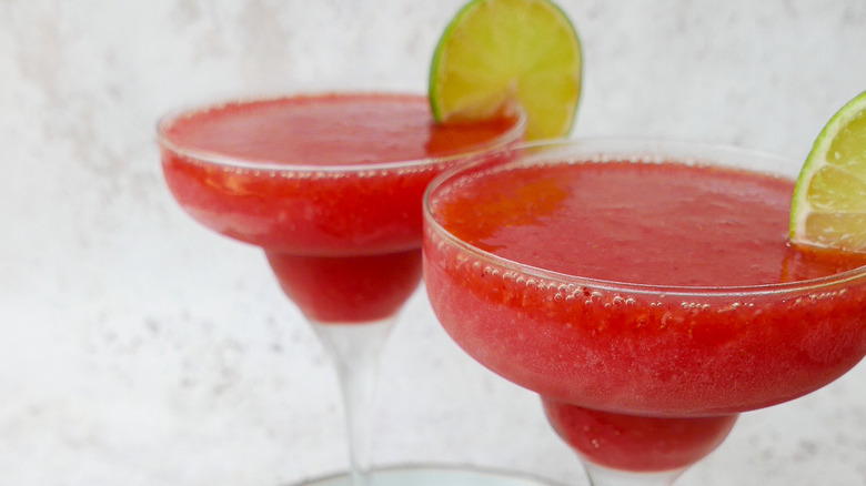 strawberry daiquiris in cocktail glasses