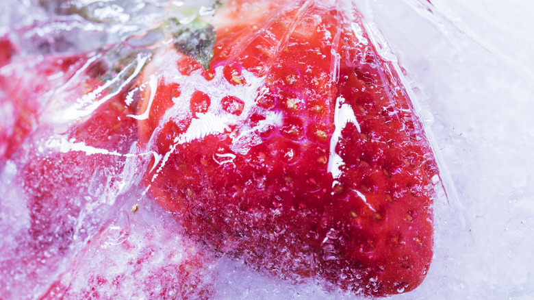 Strawberries in syrup in freezer bag