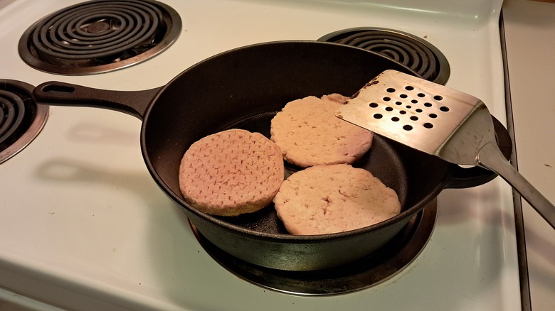 Turkey burgers in pan