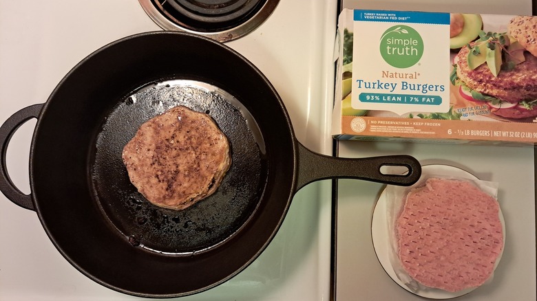 Turkey burger in frying pan