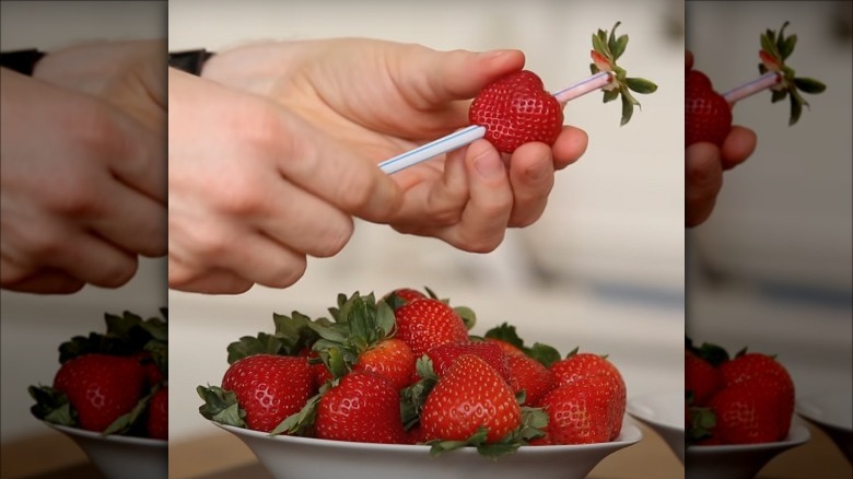 hull strawberry with straw