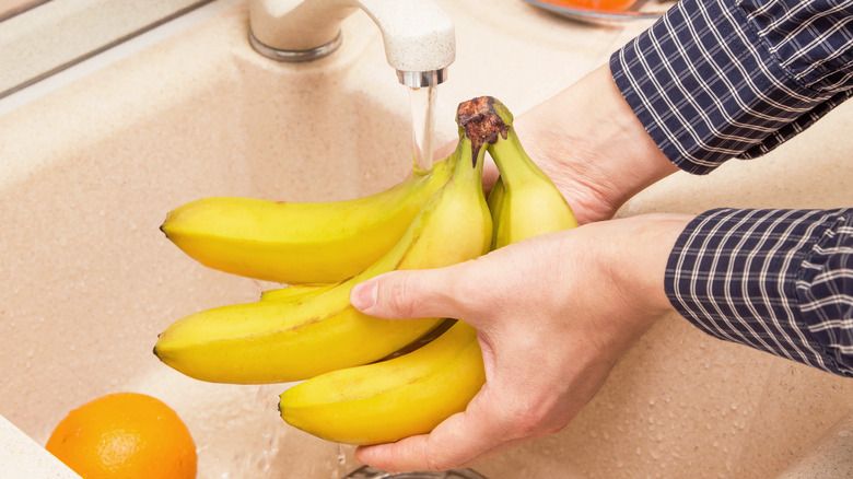 rinsing bananas in sink