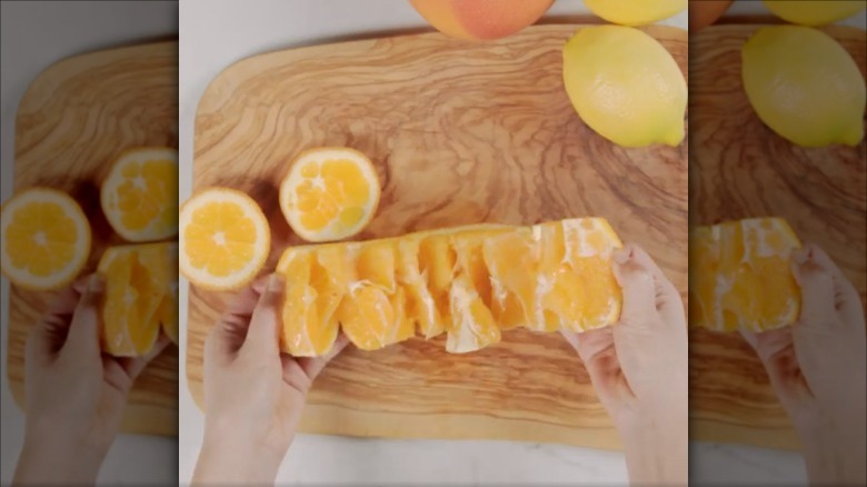 sliced orange on cutting board