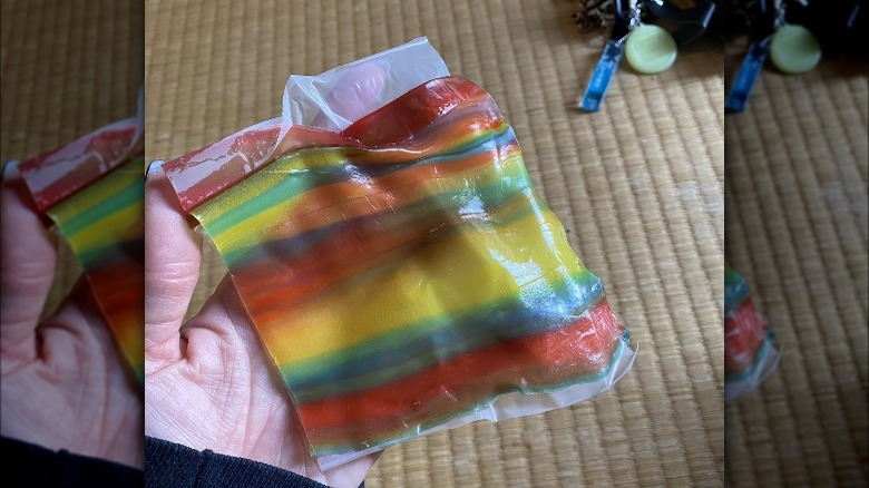 Plastic wrapped Fruit Roll-Up in hand