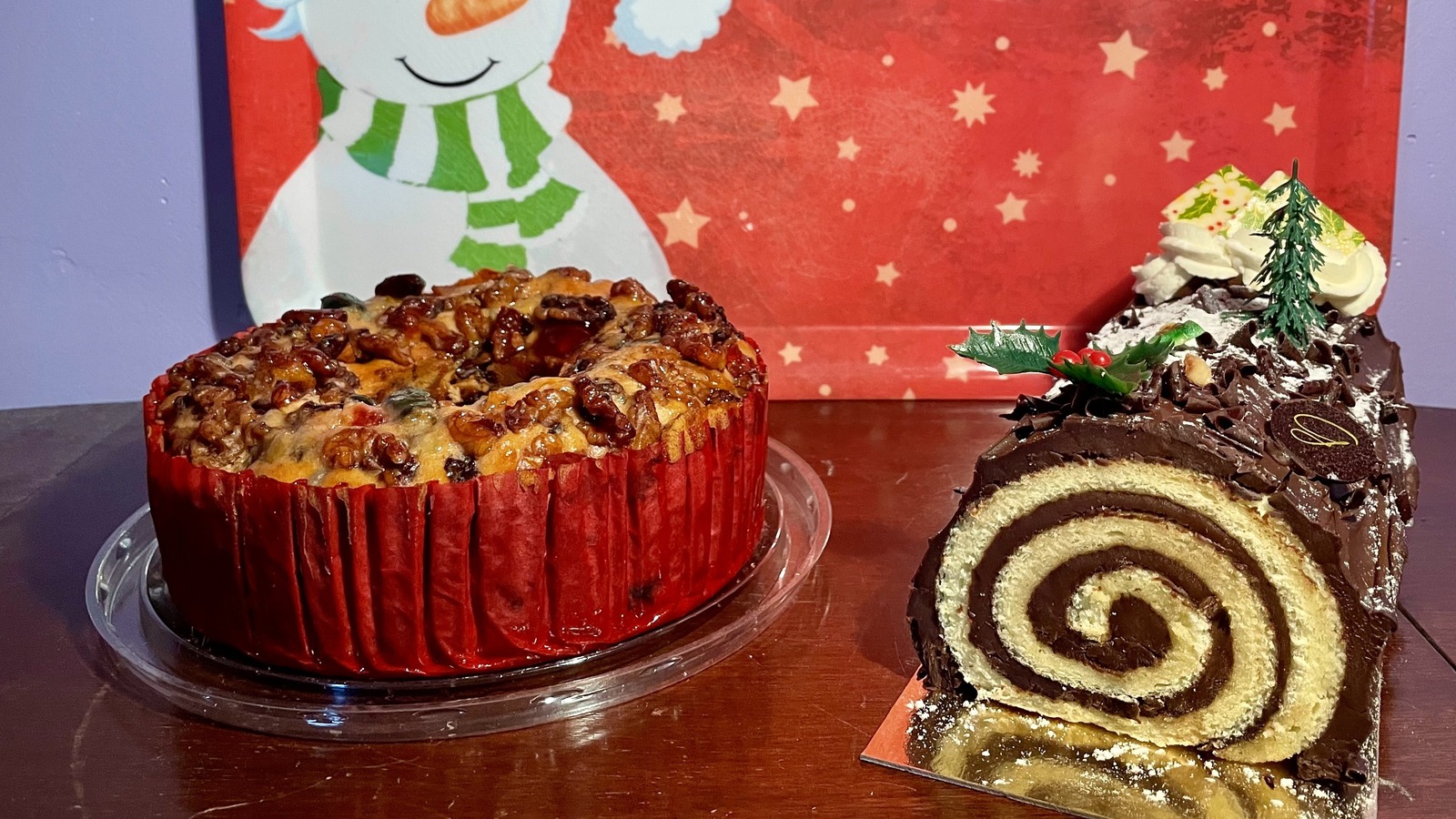 https://www.mashed.com/img/gallery/fruitcake-vs-yule-log-what-to-know-about-these-classic-holiday-cakes/l-intro-1701890245.jpg