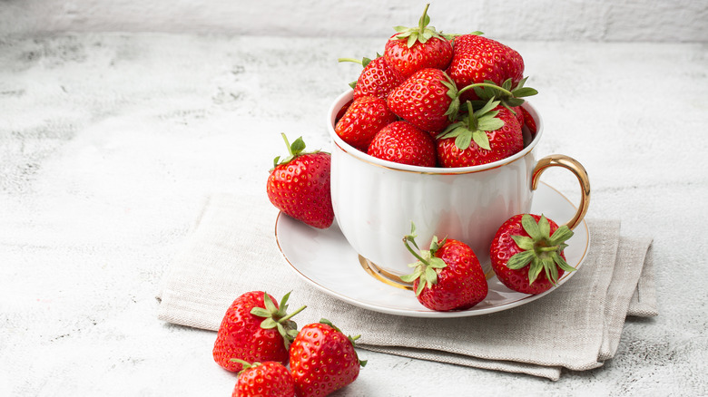 strawberries in tea cup