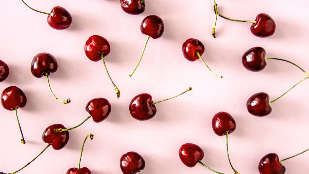 cherries against a light pink background