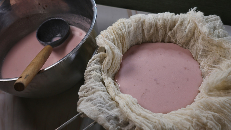 cereal milk straining through cheesecloth