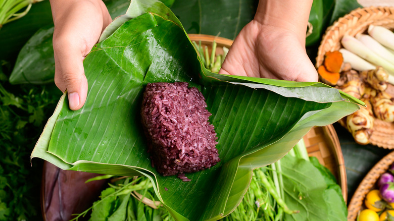 purple sticky rice in a banana leaf