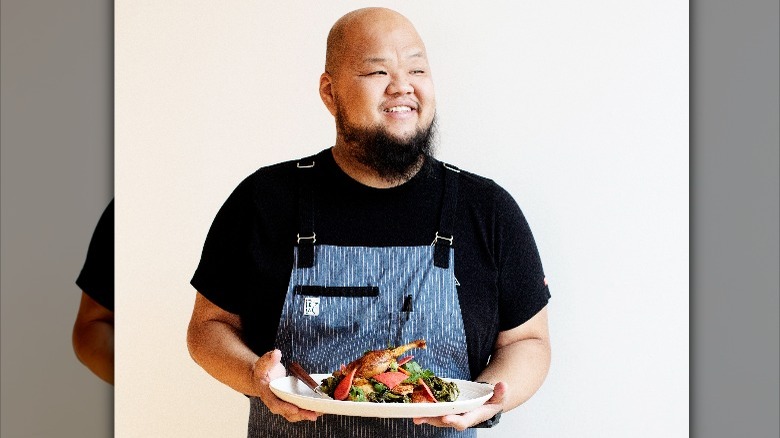 Yia Vang holds Hmong food 