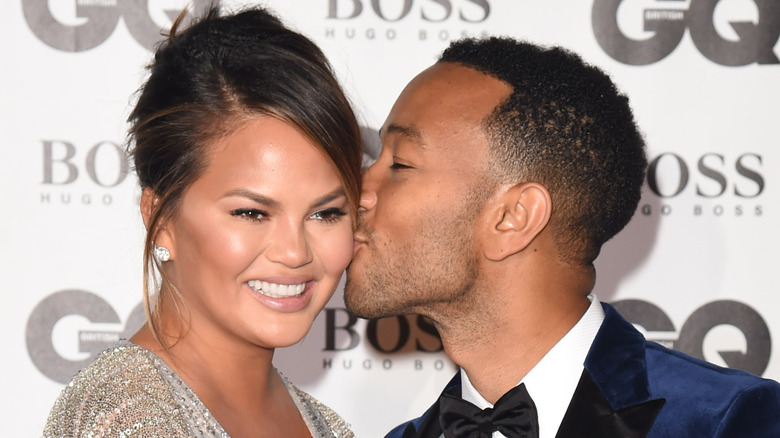 John Legend kissing Chrissy Teigen