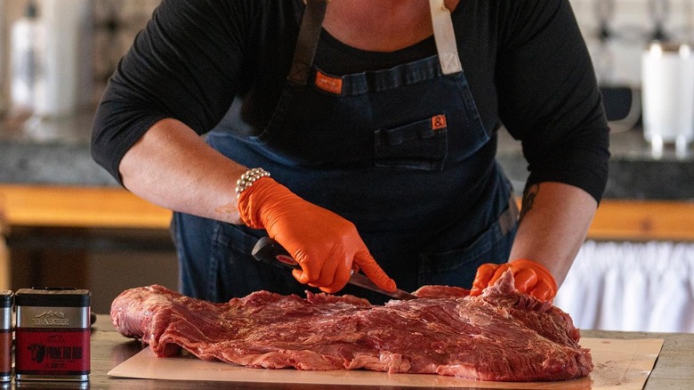 Danielle Bennett slicing meat