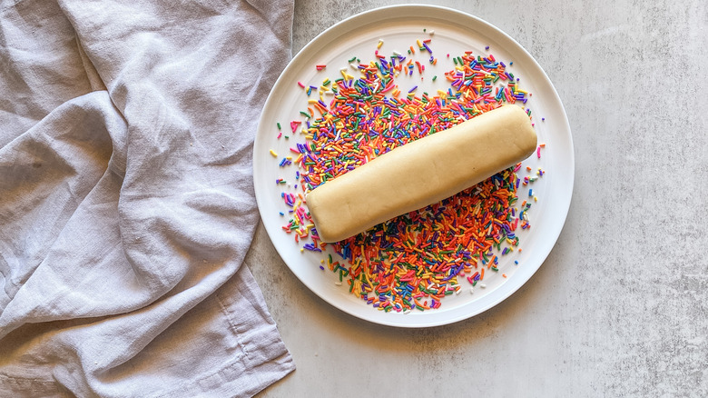 dough log in rainbow sprinkles